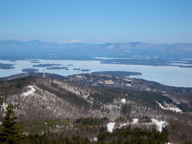 view of mountain background featuring a large body of water