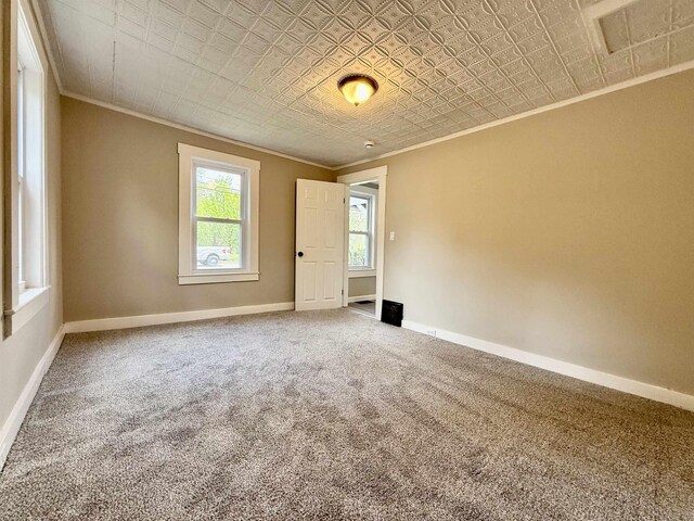 516 Hall St, Bow, NH 03304 - spare room featuring crown molding, an ornate ceiling, carpet floors, and baseboards
