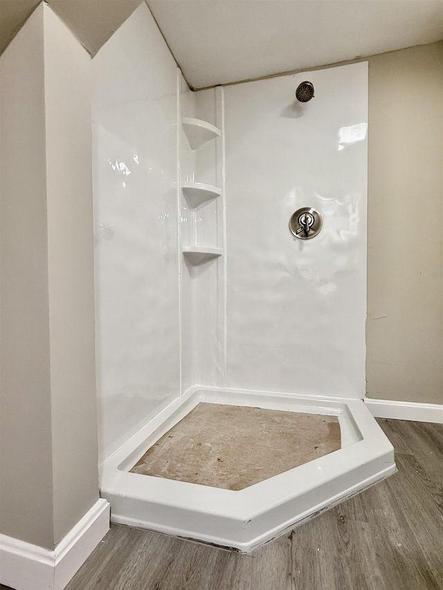 516 Hall St, Bow, NH 03304 - bathroom with wood finished floors, a shower, and baseboards