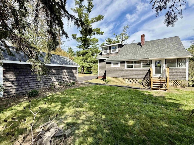 516 Hall St, Bow, NH 03304 - back of property featuring a chimney, a yard, and roof with shingles