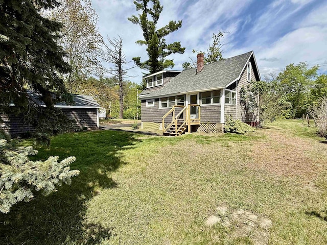 516 Hall St, Bow, NH 03304 - rear view of house featuring a chimney, a lawn, and a shingled roof
