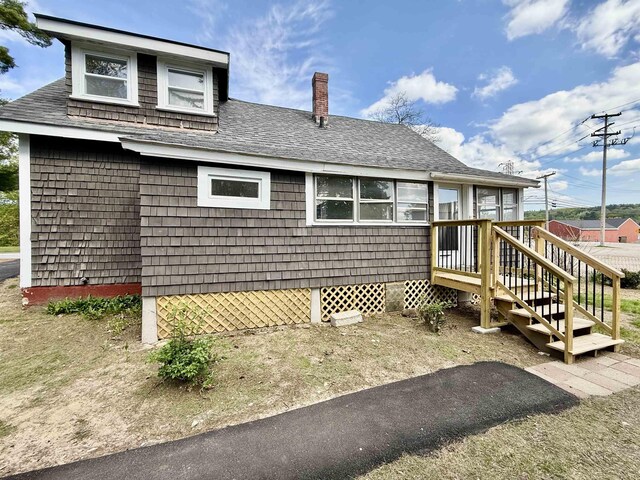 516 Hall St, Bow, NH 03304 - back of property with a shingled roof and a chimney