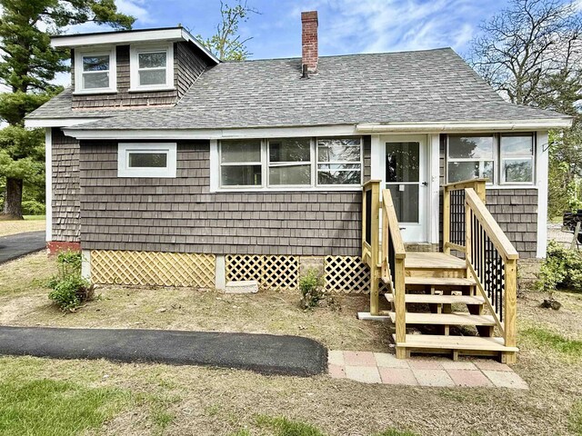 516 Hall St, Bow, NH 03304 - view of front facade with roof with shingles and a chimney
