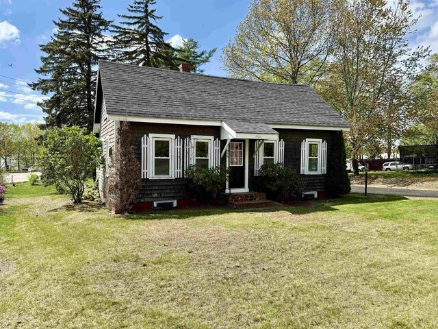 516 Hall St, Bow, NH 03304 - cape cod house with a front lawn, a shingled roof, and a chimney
