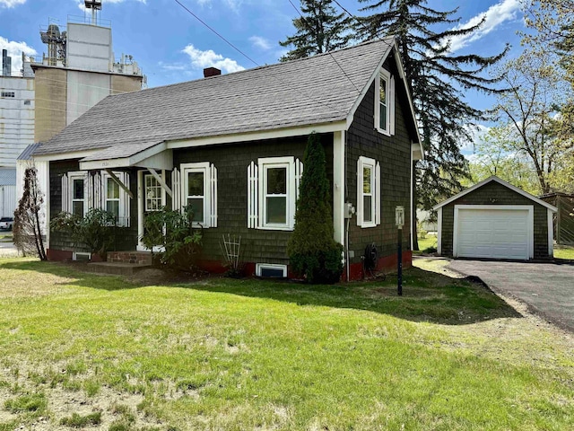 516 Hall St, Bow, NH 03304 - view of front of home featuring an outbuilding, a chimney, a detached garage, asphalt driveway, and a front yard