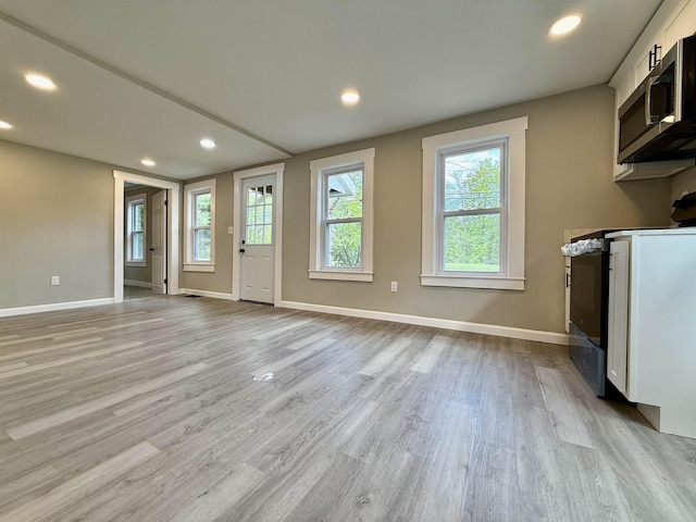 516 Hall St, Bow, NH 03304 - unfurnished living room featuring light wood-type flooring, baseboards, and recessed lighting