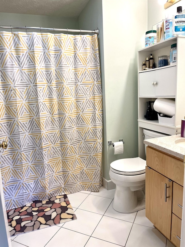 full bathroom with tile patterned flooring, toilet, vanity, and curtained shower