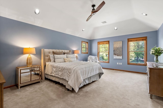 bedroom with light colored carpet, lofted ceiling, recessed lighting, baseboards, and a ceiling fan