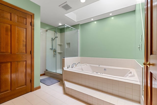 full bath with tile patterned flooring, a garden tub, a stall shower, and recessed lighting