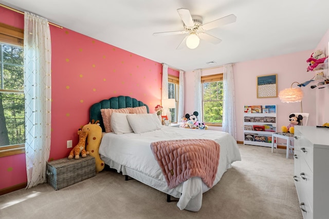 bedroom featuring carpet floors, wallpapered walls, and ceiling fan