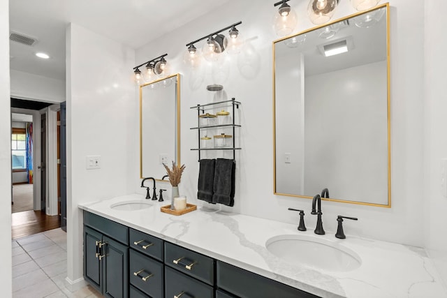 full bath with tile patterned flooring and double vanity