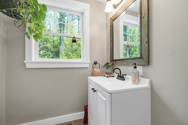 bathroom featuring vanity and baseboards
