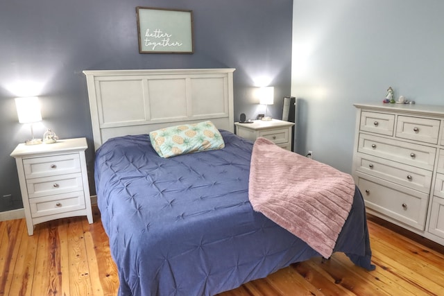 bedroom featuring light wood-style flooring