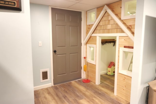 unfurnished bedroom featuring wood finished floors and baseboards