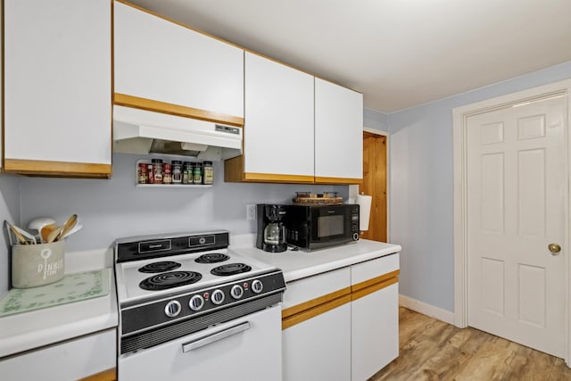 kitchen with white electric range, black microwave, under cabinet range hood, light countertops, and white cabinets