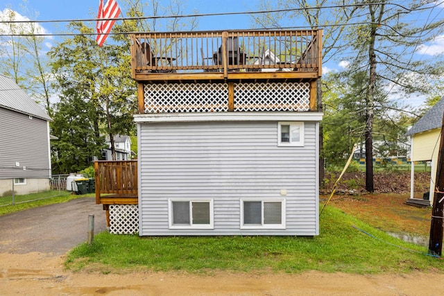 view of side of property featuring a deck