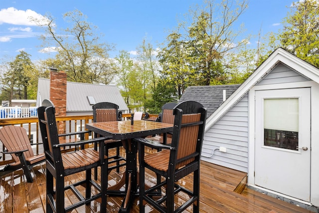 deck with outdoor dining area