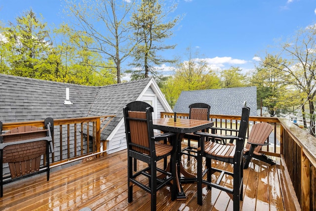 wooden deck with outdoor dining space