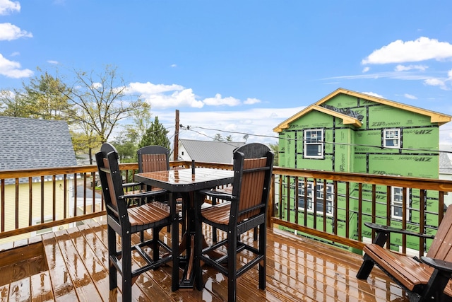 deck featuring outdoor dining area