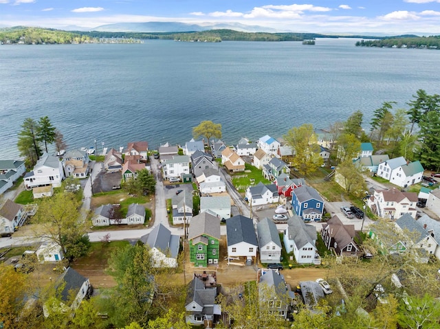 view of property location featuring nearby suburban area and a nearby body of water