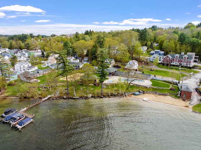 view of property location featuring nearby suburban area and a nearby body of water