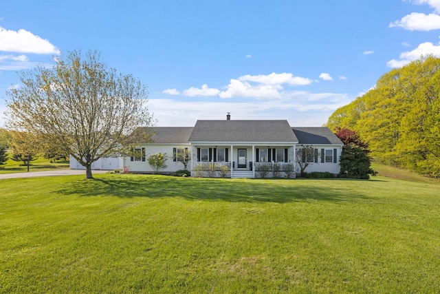 view of front of property with a porch, concrete driveway, a front yard, and a garage