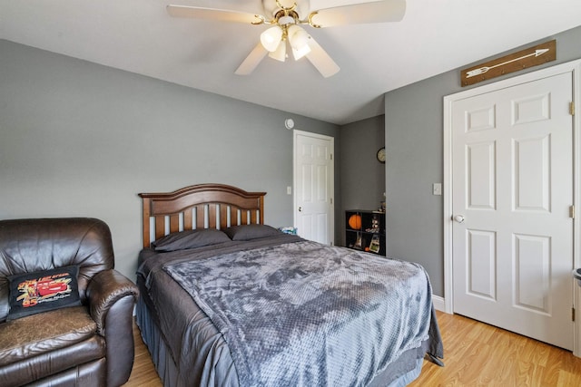 bedroom with light wood-type flooring and a ceiling fan