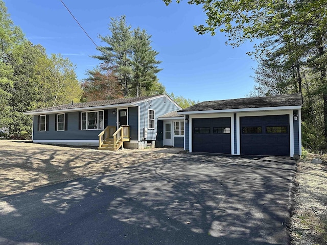 view of front of property featuring driveway and an attached garage