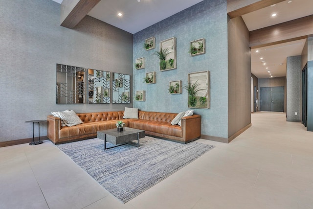 tiled living room with a high ceiling, baseboards, recessed lighting, and beamed ceiling