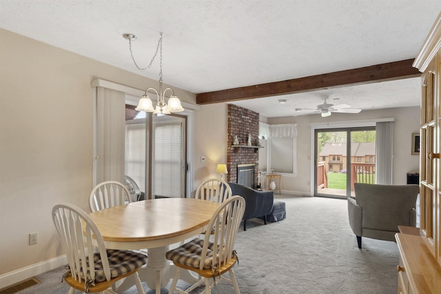 carpeted dining space featuring a chandelier, beamed ceiling, a textured ceiling, baseboards, and a fireplace