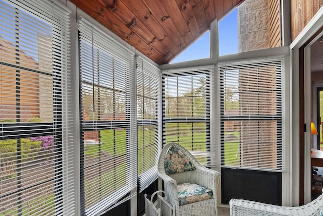 sunroom featuring lofted ceiling