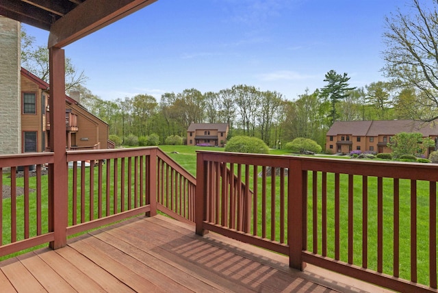 wooden deck with a yard