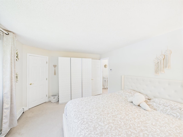 8 Lincoln Dr Unit B, Hooksett, NH 03106 - bedroom with baseboard heating, light carpet, and a closet