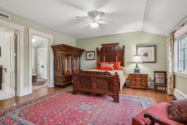 5893 Stage Rd, Barnard, VT 05031 - bedroom with vaulted ceiling, wood finished floors, ceiling fan, and baseboards