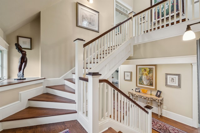 5893 Stage Rd, Barnard, VT 05031 - staircase with wood finished floors and high vaulted ceiling