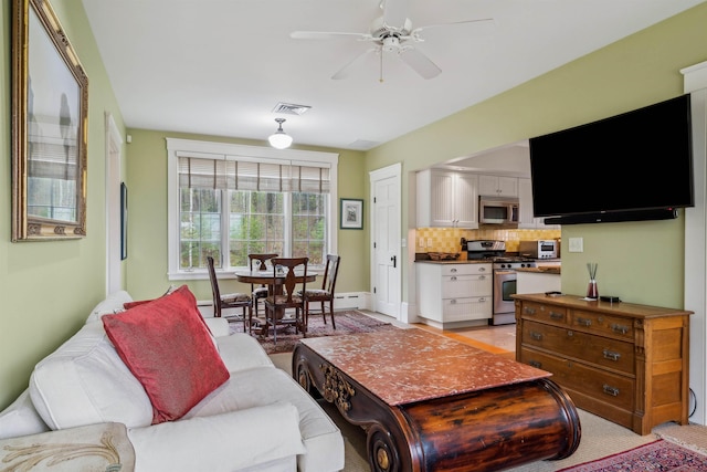 5893 Stage Rd, Barnard, VT 05031 - living area featuring ceiling fan and baseboards