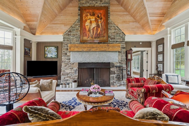 5893 Stage Rd, Barnard, VT 05031 - living area with wood ceiling, decorative columns, lofted ceiling, and a fireplace