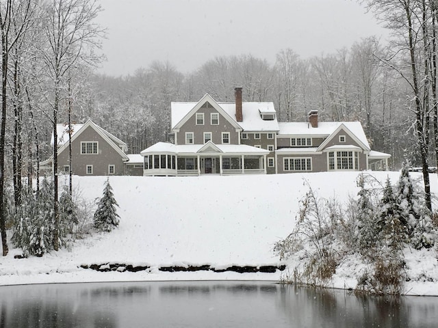 5893 Stage Rd, Barnard, VT 05031 - snow covered house with a sunroom and a chimney