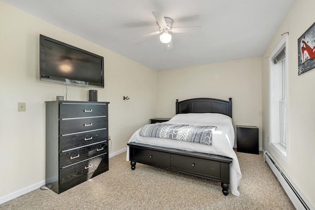 bedroom featuring baseboard heating, light colored carpet, baseboards, and ceiling fan