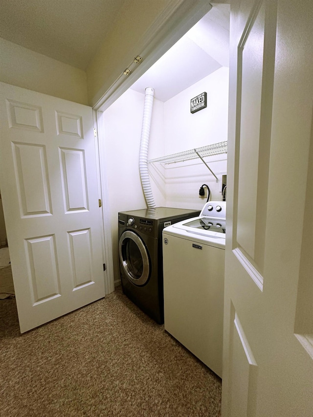 clothes washing area featuring separate washer and dryer and carpet floors