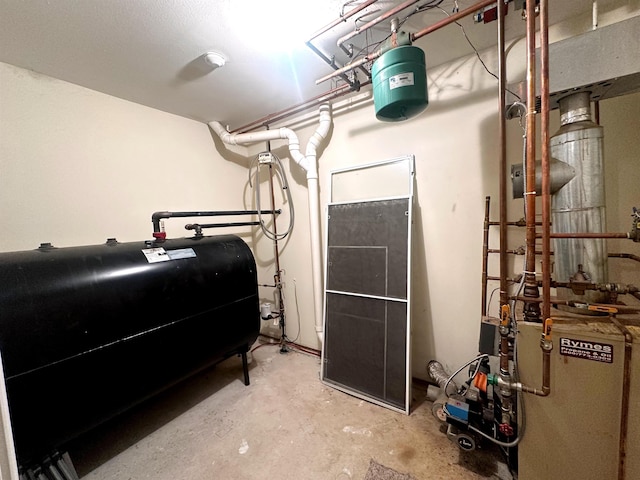 utilities featuring oil tank and a heating unit
