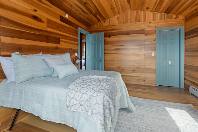 121 Ridge Ln, Westmore, VT 05860 - bedroom with wooden walls, vaulted ceiling, wood ceiling, and wood finished floors