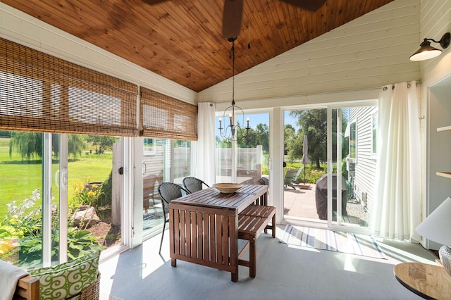 sunroom / solarium with wood ceiling, wood finished floors, high vaulted ceiling, and a chandelier