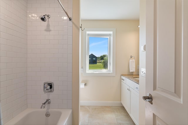 full bathroom featuring baseboards, vanity, and washtub / shower combination
