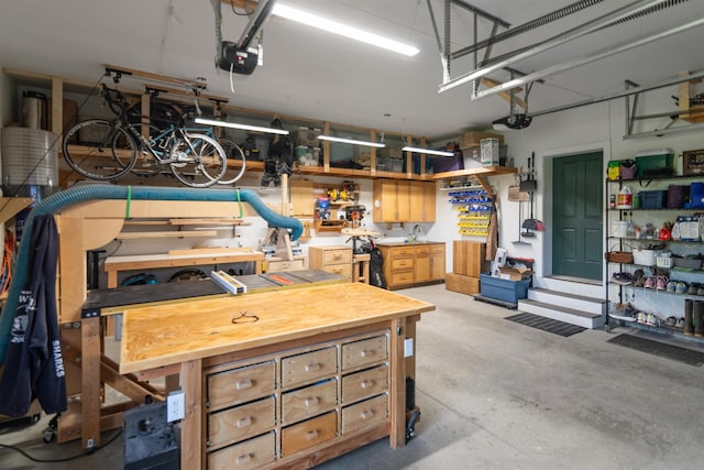 garage featuring a workshop area and a garage door opener