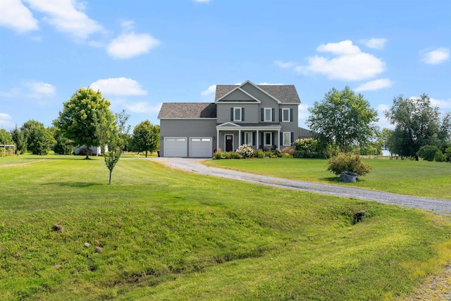 view of front of house featuring driveway, a front lawn, a garage, and roof with shingles