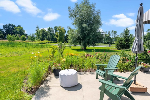 view of patio / terrace with view of wooded area