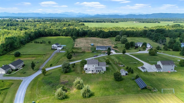 aerial view of property's location featuring rural landscape and a mountainous background