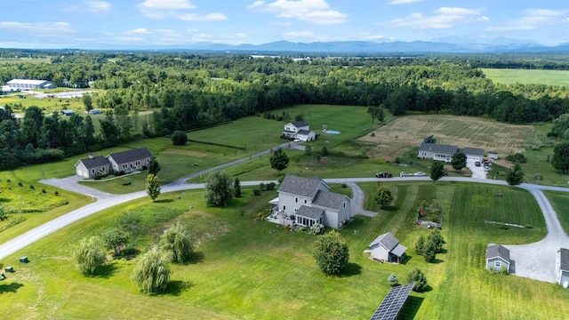 aerial view of sparsely populated area featuring a mountainous background