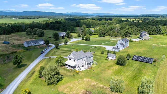 view of property location with rural landscape and a mountain backdrop